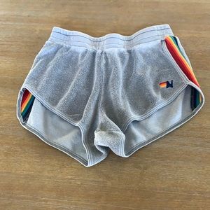 Aviator Nation gray shorts with stripes down the sides.